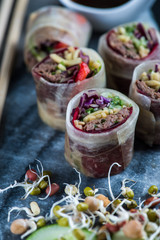 Oriental teriyaki beef bites on marble board