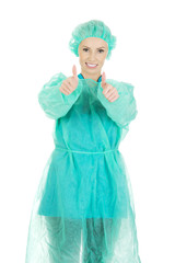 Woman surgeon doctor with thumbs up.