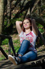 Time for relax , lying down on wooden bridge in the forest