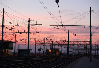 Impression network at transformer station in sunrise, high voltage up to full color sky take with sunset tone, horizontal frame