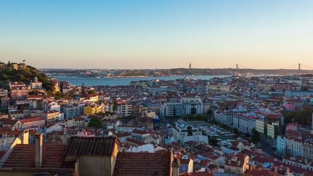 4K day to night timelapse of Lisbon rooftop from  Senhora do monte miradouro viewpoint in Portugal - UHD