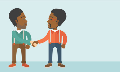 Two African-american guys happily handshaking.