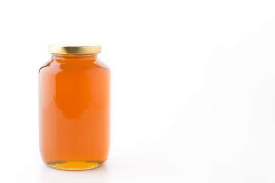 Honey Bottle On White Background