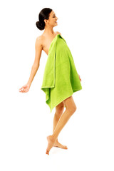 Happy woman wrapped in towel