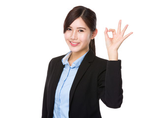 Young businesswoman with ok sign gesture