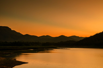 Colorful sunset over the mountain hills