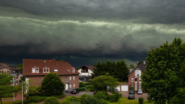 Timelapse of a spectacular cloud front of an upcoming thunderstorm turning day into night. The thunderstorm was one of the worst of the last decade in the west of Germany and caused heavy damage.