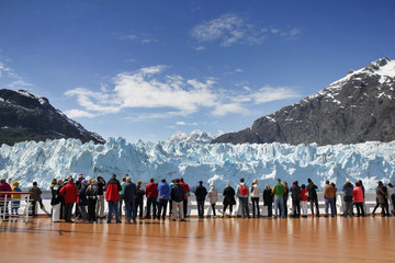 Cruise passengers watching glacier in Alaska