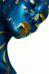 Obraz na płótnie Canvas Halloween Makeup. Closeup beauty fashion Woman with blue gold Sk