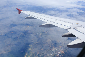 Fototapeta premium view from the airplane window, cloudy day