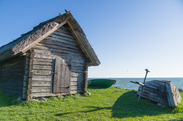 Rural fisherman utility house and boats at sea coast