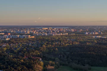 Fototapete Sunset over Tallinn city residential area, aerial view © alexpolo