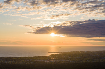 Obraz premium Sunset over Tallinn city and Baltic sea, aerial view