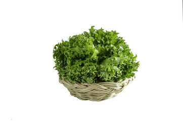 Fresh green iceberg lettuce in rattan basket