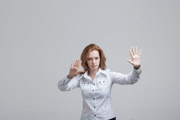 Young girl working with virtual screen