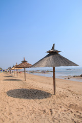 Grass umbrellas at the beach
