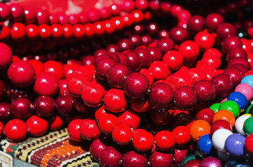 Wooden red beads on the market