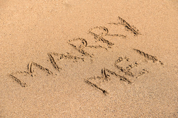 Marry Me Word Written On Sunny Summer Beach Sand