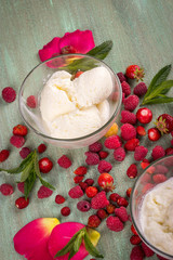ice cream in transparent glass plates scattered around the raspb
