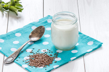 yogurt with old silver spoon and flax 