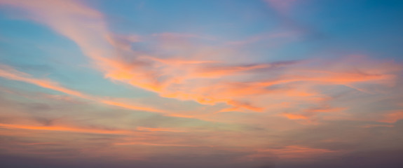 Sunset sky with orange colored clouds. 
