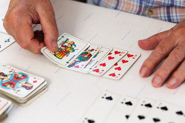 Elderly couple playing cards