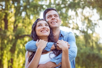 Cute couple smiling in the park