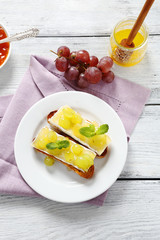 Bruschetta with cheese and grapes