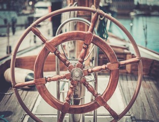 Helm on a vintage wooden yacht