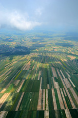 Fototapeta na wymiar Aerial view of the countryside with village and fields of crops