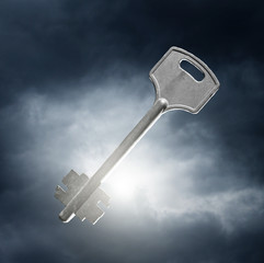 key against dramatic sky background