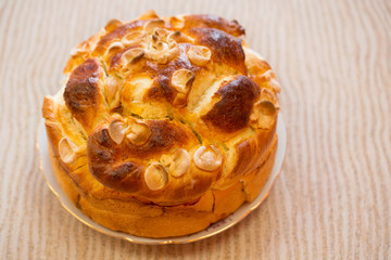 Festive baked bread on table background/Traditional food