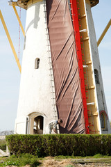 Fototapeta na wymiar miller is putting the sails on the corn mill