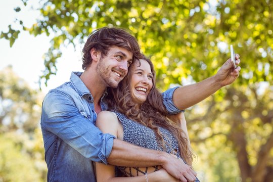 Hipster couple taking a selfie