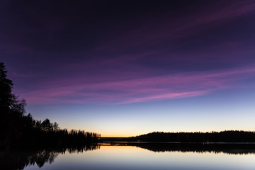 Serene view of calm lake at twilight - 85572821