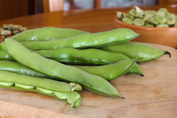 Fresh broad beans fava on wood table
