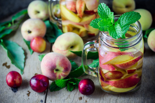 Jar delicious refreshing drink of peach fruits and plum  with mi