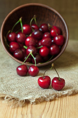 Healthy organic vegetarian super food cherries in clay dish on
