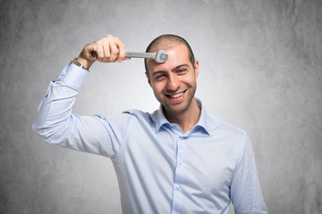 Man using a wrench to adjust his mind