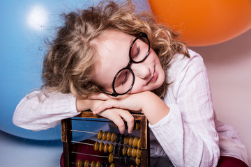 Portrait of teen girl dreaming in glasses with eyes closed again
