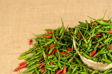 Green and red Thai chili peppers