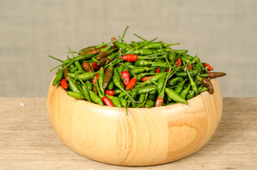 Green and red Thai chili peppers