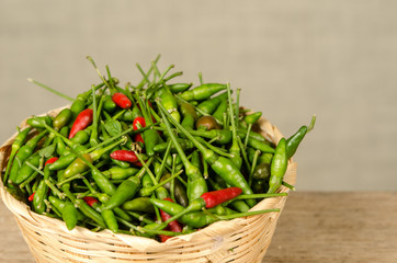 Green and red Thai chili peppers