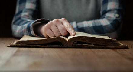 Woman hands reading the bible
