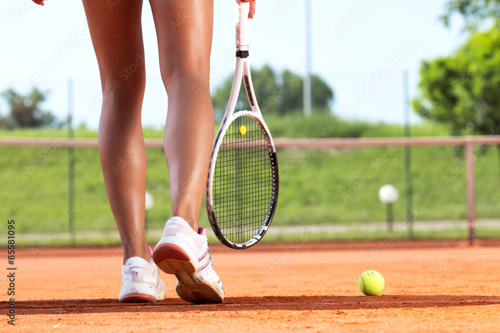 Poster Legs of female tennis player.Close up image.