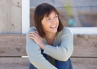 Natural older lady smiling outside