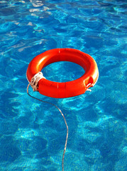 Life belt floating on water.