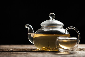 Green tea with jasmine a in a glass teapot