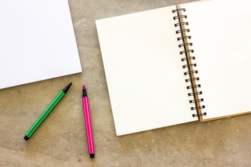 Blank stationery set on concrete background for presentation and business / book and color magic pen