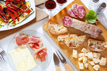 Italian healthy snacks. prosciutto, salami, vegetables grilled p